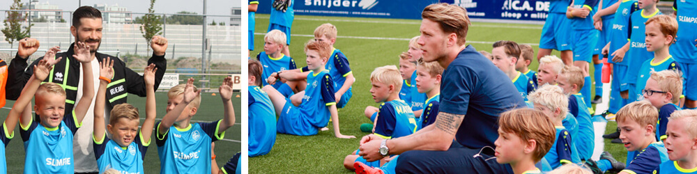 Profvoetballers op het voetbalveld tussen de kinderen